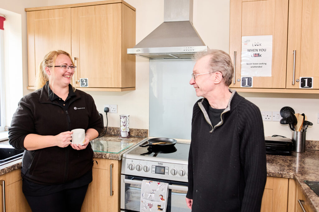 A member of the Sustain UK team during a visit to a resident at one of its high-quality homes.